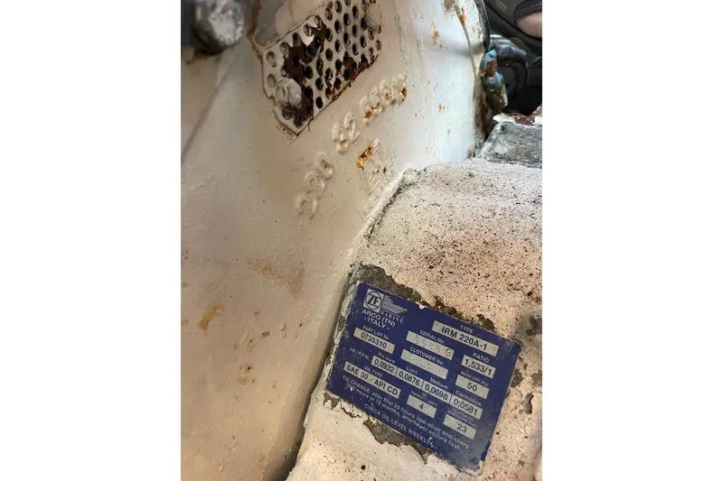 Slide: The Image of 1999 Albemarle 30 engine detail with ZF Marine transmission plate, showing model and specifications. - 32