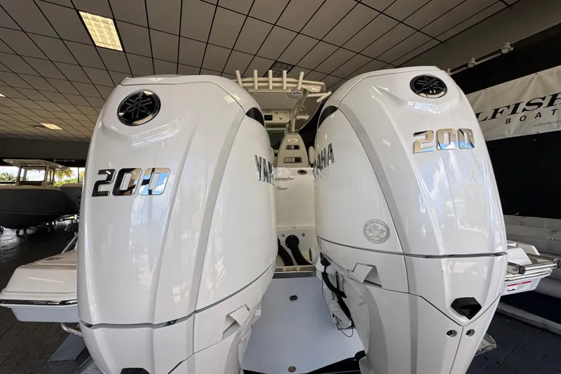Slide: The Image of Twin Yamaha 200 engines on a 2026 Sailfish 272 CC boat in showroom. - 7