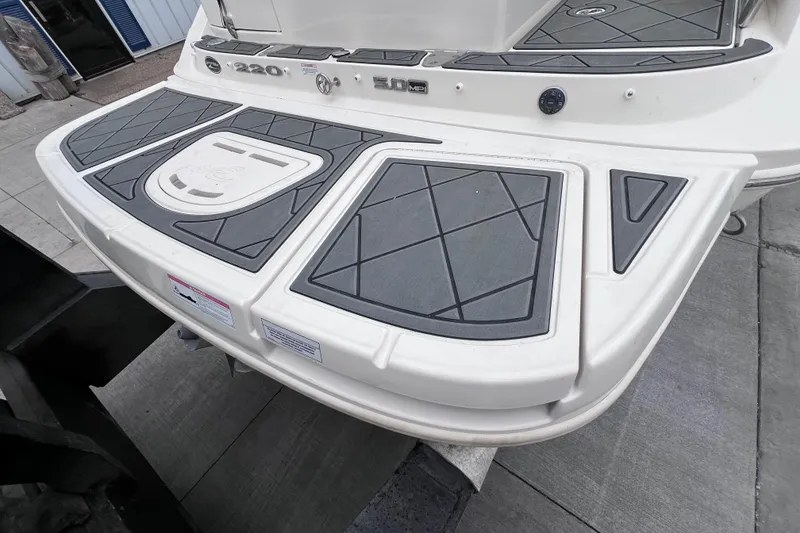 Slide: The Image of 2010 Sea Ray 220 Sundeck swim platform with non-slip surface and sleek design. - 13