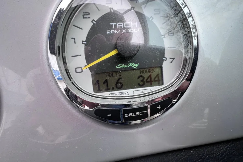 Slide: The Image of Tachometer of 2010 Sea Ray 220 Sundeck showing 344 hours and 11.6 volts. - 36