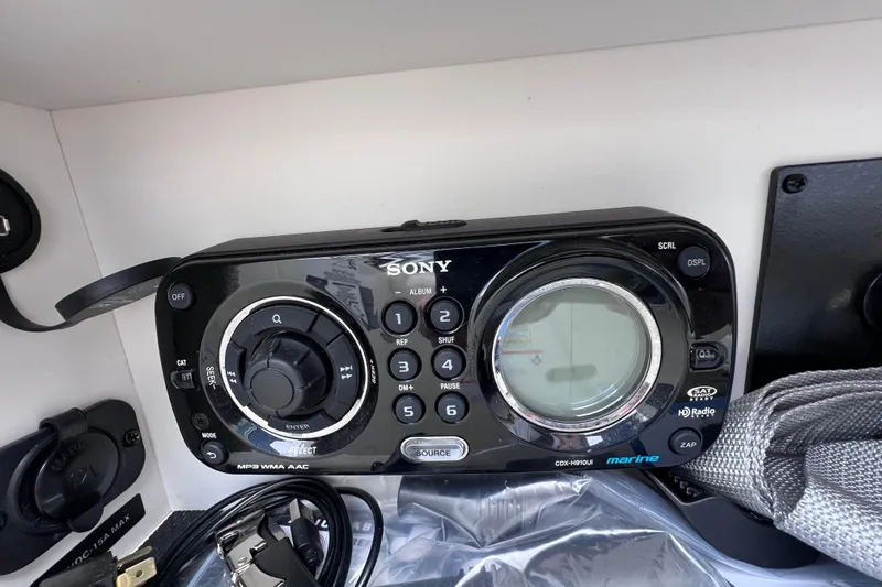 Slide: The Image of Sony marine stereo system on 2010 Sea Ray 220 Sundeck boat dashboard. - 37