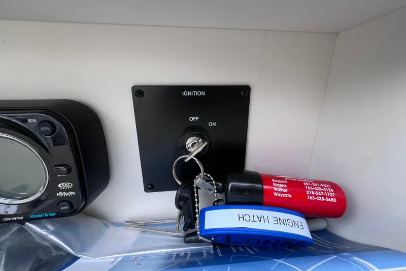 Slide: The Image of Ignition switch and keys on a 2010 Sea Ray 220 Sundeck boat dashboard. - 38