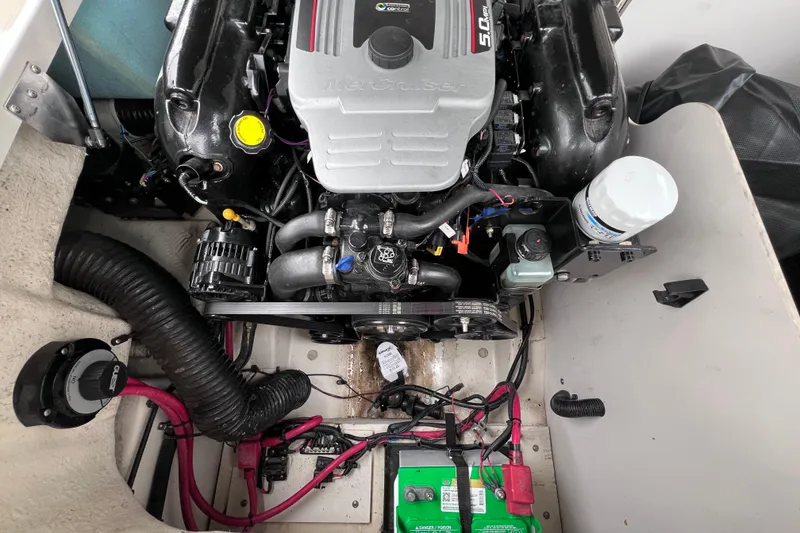 Slide: The Image of Engine compartment of a 2010 Sea Ray 220 Sundeck boat, showing detailed components. - 40