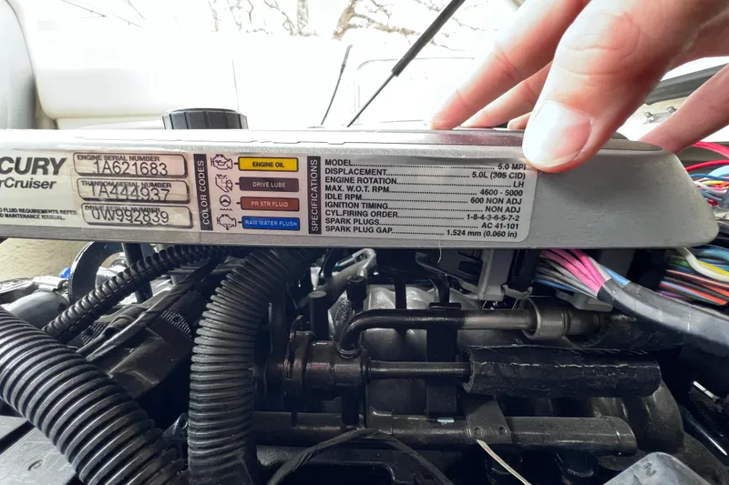 Slide: The Image of Engine specifications of a 2010 Sea Ray 220 Sundeck boat with serial numbers visible. - 47