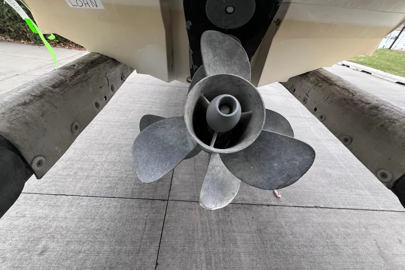 Slide: The Image of Propeller of 2010 Sea Ray 220 Sundeck boat on concrete surface. - 49