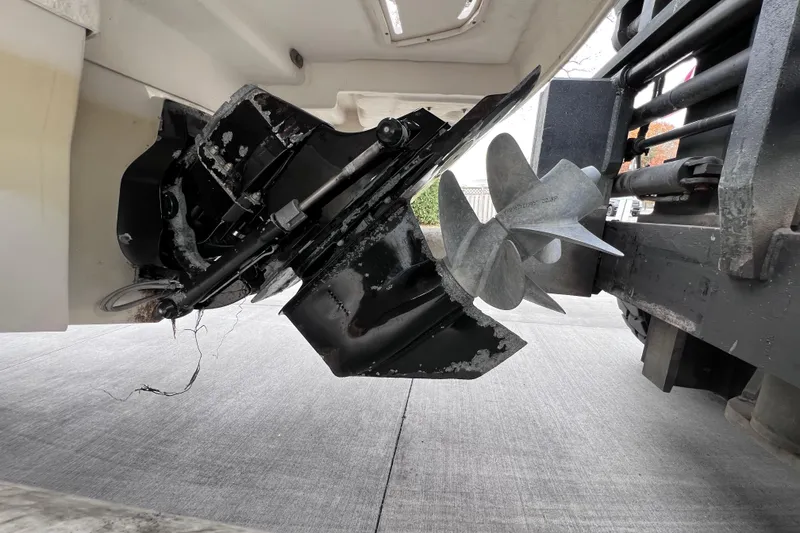 Slide: The Image of Damaged propeller of 2010 Sea Ray 220 Sundeck on concrete surface. - 51