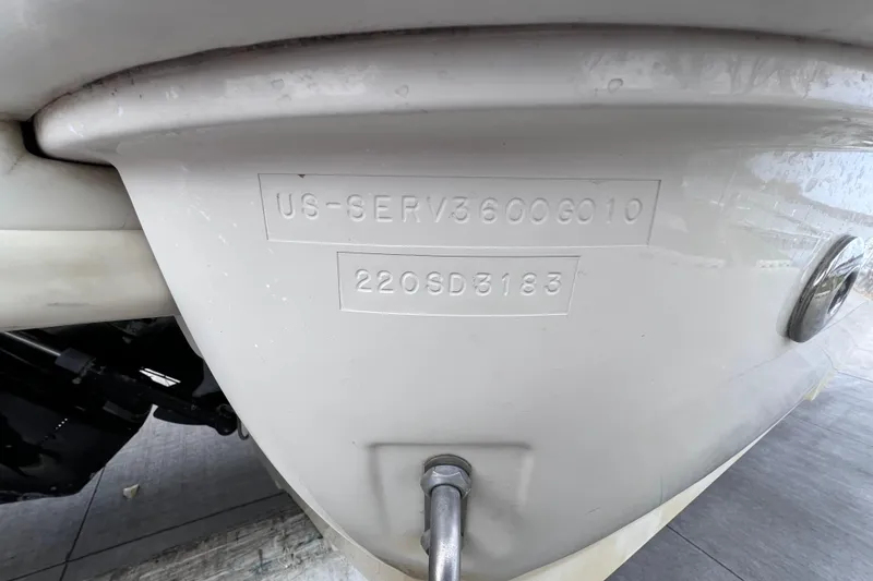 Slide: The Image of 2010 Sea Ray 220 Sundeck hull identification number close-up. - 53