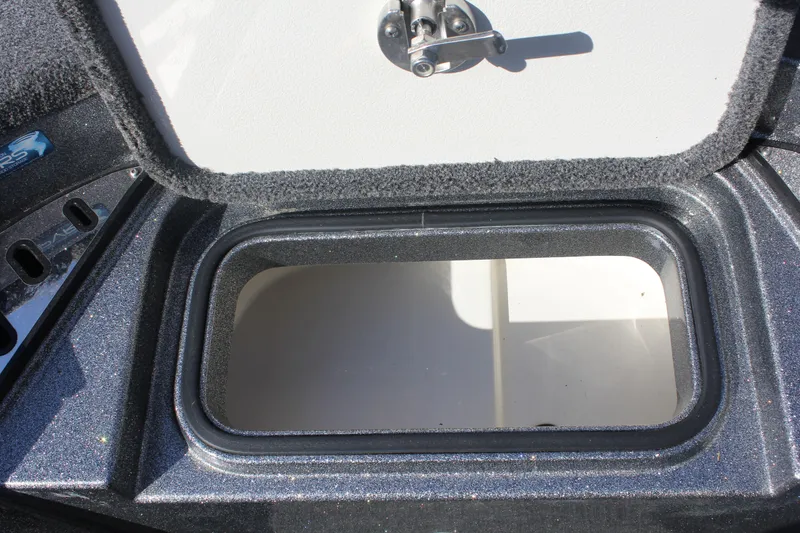 Slide: The Image of Open storage compartment on a 2020 Ranger Z520L boat. - 10