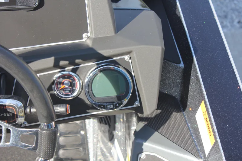 Slide: The Image of Dashboard of a 2020 Ranger Z520L boat with gauges and controls. - 17