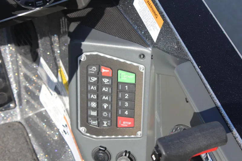 Slide: The Image of Control panel of a 2020 Ranger Z520L boat with various buttons and switches. - 18