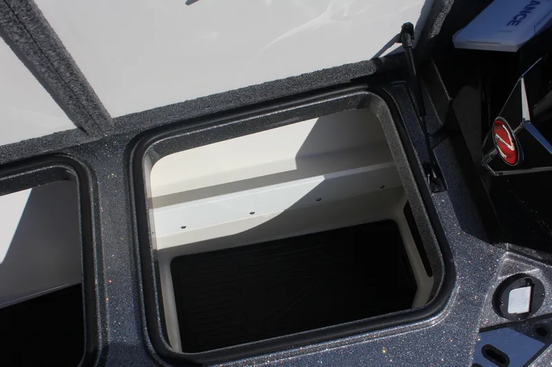 Slide: The Image of Open storage compartment in 2020 Ranger Z520L boat, featuring sleek design and durable materials. - 9