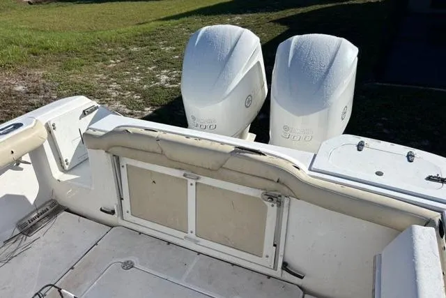 Slide: The Image of 2019 Everglades 290 Center Console boat with twin outboard engines, rear view. - 9