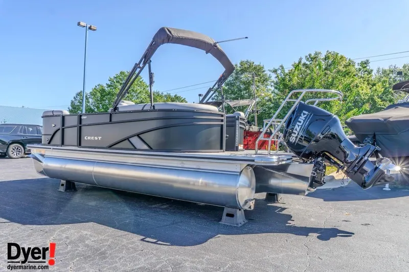 Slide: The Image of 2026 Crest Conquest 210 SLC pontoon boat with Suzuki outboard motor in a sunny outdoor setting. - 5