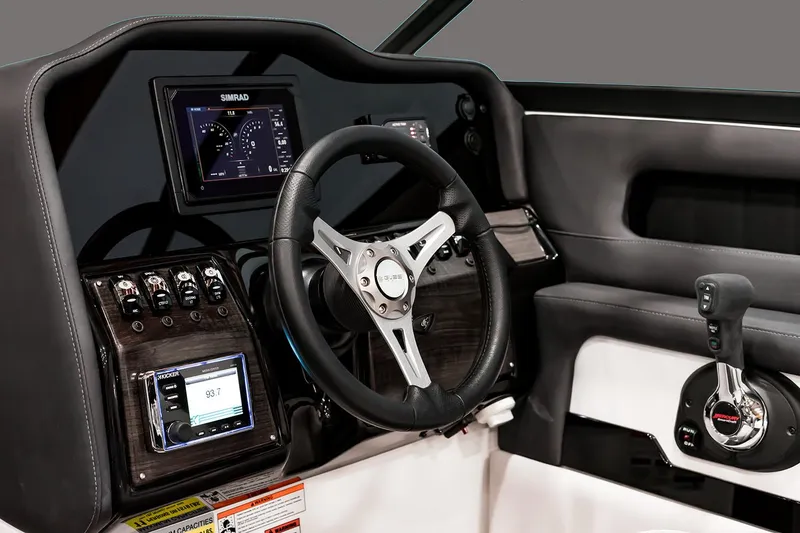 Slide: The Image of Manufacturer Provided Image: 2018 Rinker Q5 OB boat dashboard with steering wheel and control panel. - 21