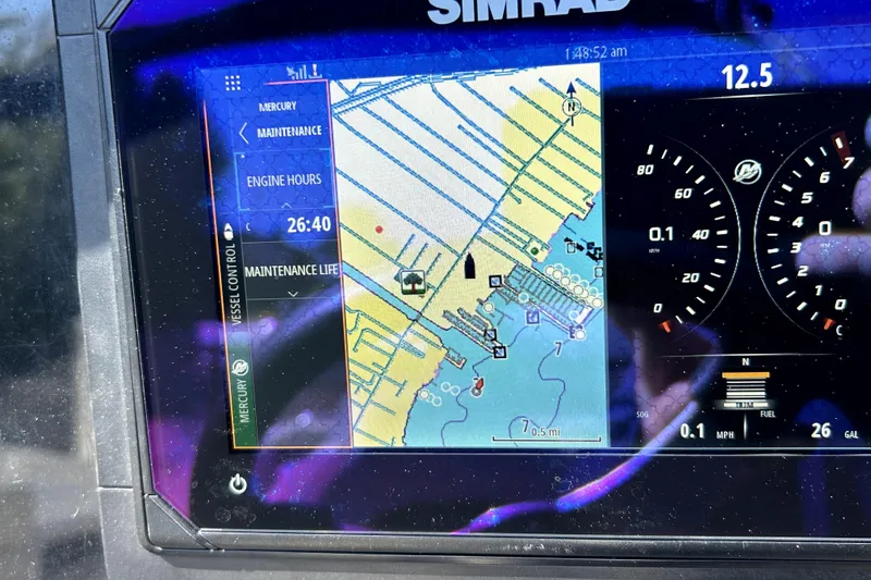 Slide: The Image of Simrad navigation display on 2018 Rinker Q5 OB boat showing map and engine data. - 7