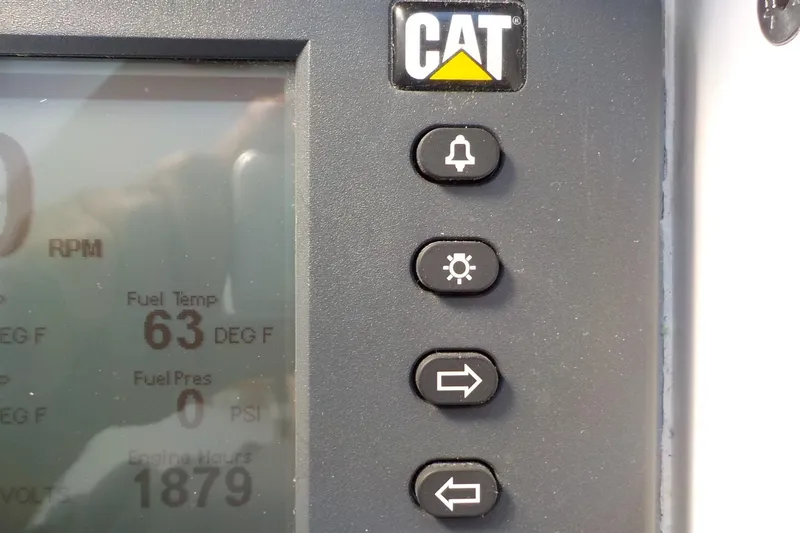 Slide: The Image of CAT engine control panel with fuel temperature at 63°F and engine hours at 1879. - 18