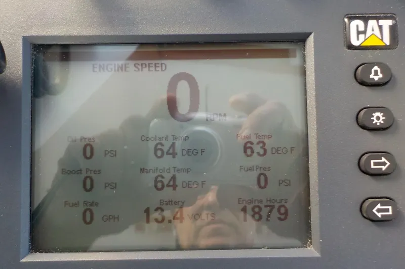 Slide: The Image of Dashboard display of a 2008 Calvin Beal Downeast boat engine metrics. - 19