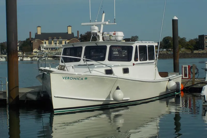 Slide: The Image of 2008 Calvin Beal Downeast boat "Veronica" docked at marina. - 2