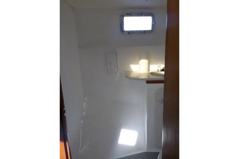 Slide: The Image of 2008 Calvin Beal Downeast boat interior with sink and window. - 39