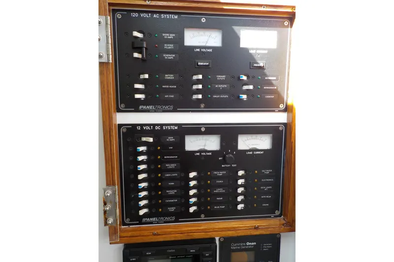 Slide: The Image of Electrical control panel on a 2008 Calvin Beal Downeast boat, featuring AC and DC systems. - 40