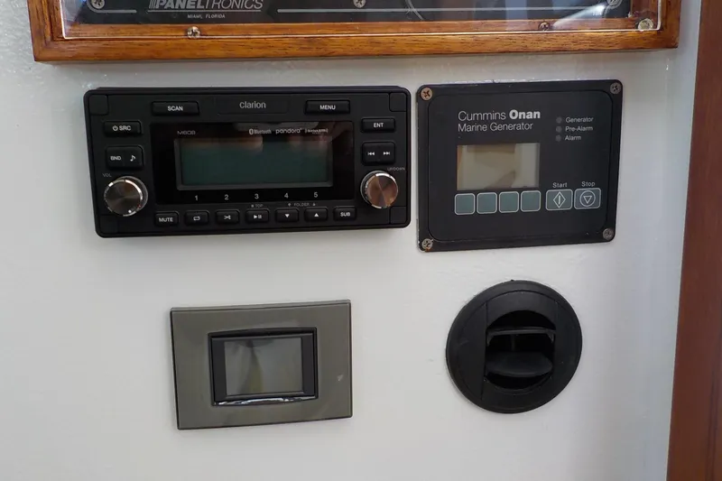 Slide: The Image of Control panel of a 2008 Calvin Beal Downeast boat with audio and generator systems. - 41