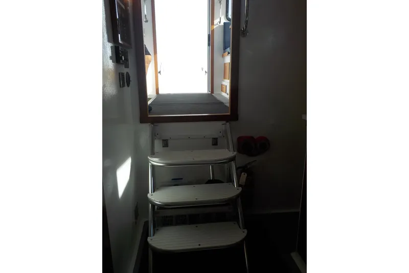 Slide: The Image of Stairway inside 2008 Calvin Beal Downeast boat leading to open hatch. - 44