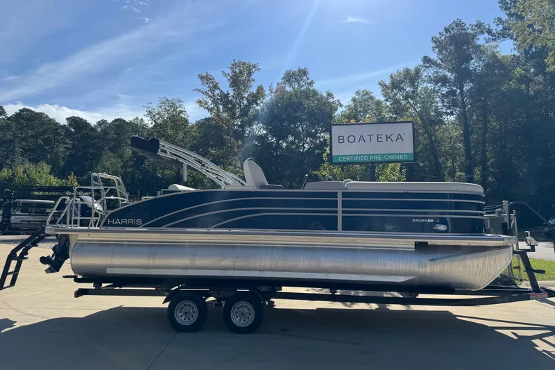 The Image of 2025 Harris Sunliner 230 pontoon boat on trailer at Boateka dealership. - 0