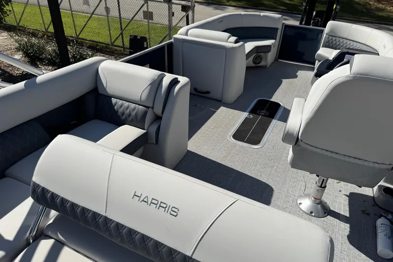 Slide: The Image of 2025 Harris Sunliner 230 pontoon boat interior with luxurious seating and modern design. - 5