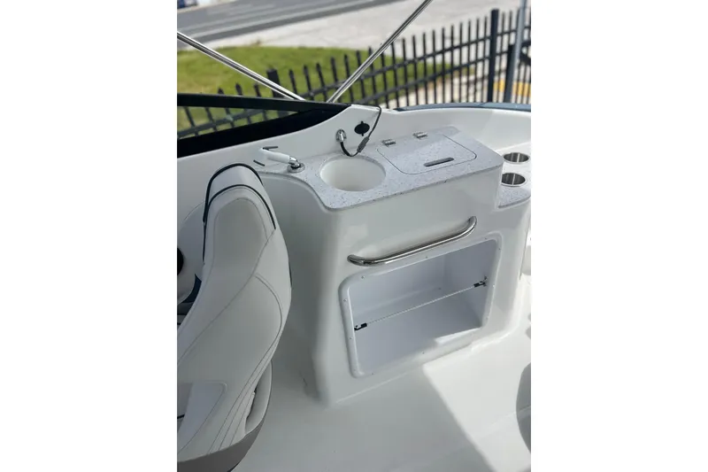 Slide: The Image of 2026 Hurricane SunDeck 2400 OB boat interior with sink and storage area. - 14