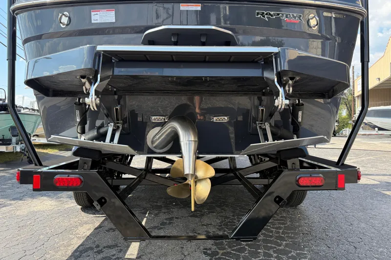 Slide: The Image of Rear view of 2026 Moomba Tykon boat with Raptor Indmar engine and trailer. - 10