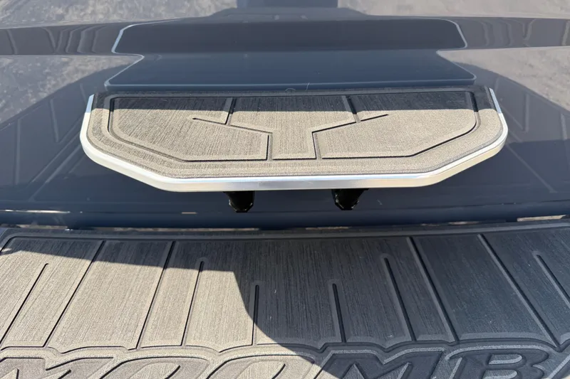 Slide: The Image of 2026 Moomba Tykon boat platform with textured surface and sleek design. - 12