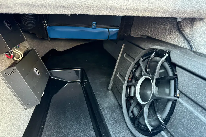 Slide: The Image of 2026 Moomba Tykon interior audio system with subwoofer and amplifier setup. - 36