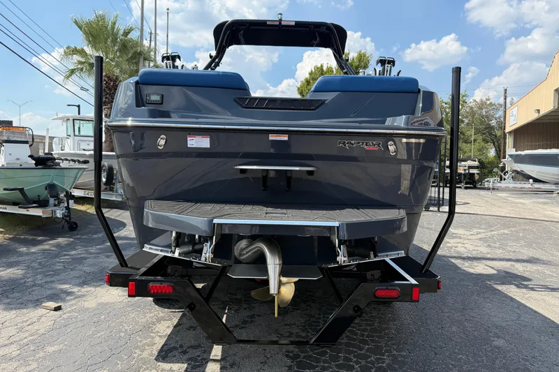 Slide: The Image of 2026 Moomba Tykon boat rear view, showcasing sleek design and Raptor engine. - 4