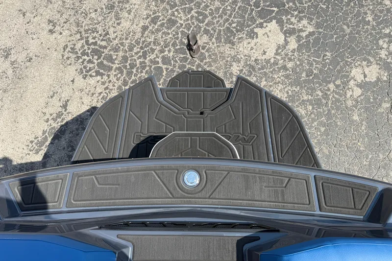 Slide: The Image of 2026 Moomba Tykon boat deck with textured black surface and blue accents. - 41