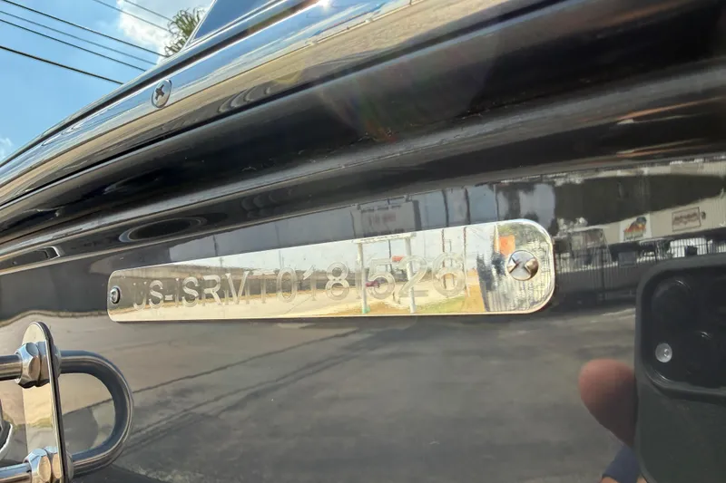 Slide: The Image of 2026 Moomba Tykon boat hull identification number plate close-up. - 9