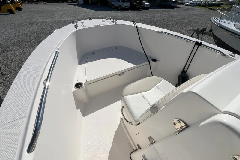 Slide: The Image of 2014 Robalo R180 Center Console boat interior with seating and storage. - 3