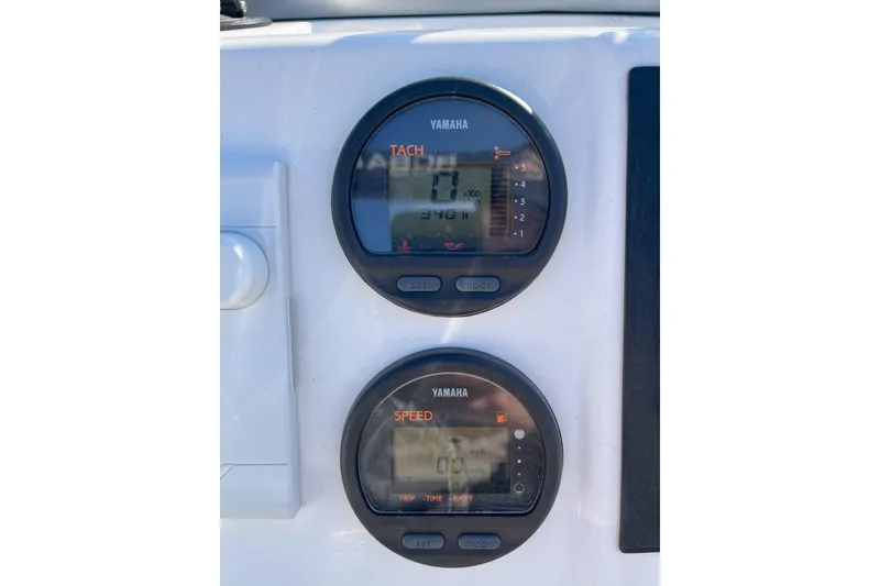 Slide: The Image of Yamaha tachometer and speedometer on 2014 Robalo R180 Center Console boat dashboard. - 9