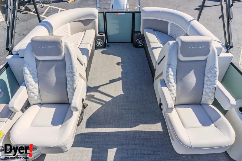 Slide: The Image of 2026 Crest Conquest 230 SLC pontoon boat interior with luxurious seating and modern design. - 11