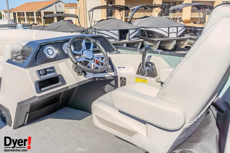 Slide: The Image of 2026 Crest Conquest 230 SLC boat cockpit with steering wheel and controls. - 12