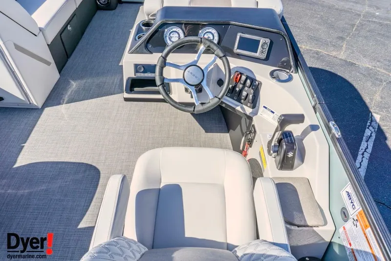 Slide: The Image of Interior view of 2026 Crest Conquest 230 SLC boat cockpit with steering wheel and controls. - 13