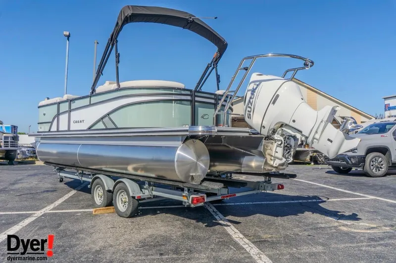 Slide: The Image of 2026 Crest Conquest 230 SLC pontoon boat on trailer, featuring Suzuki outboard motor. - 3