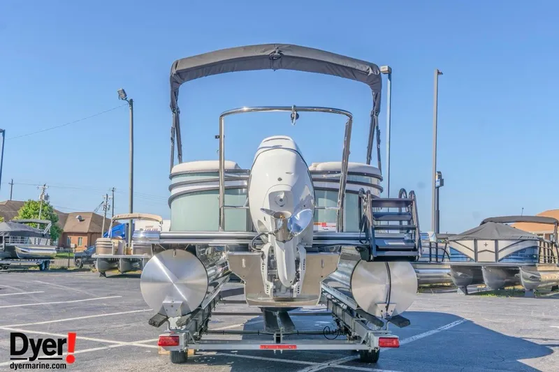 Slide: The Image of 2026 Crest Conquest 230 SLC pontoon boat on trailer in parking lot. - 4