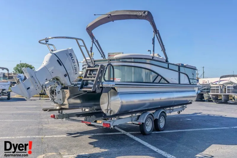Slide: The Image of 2026 Crest Conquest 230 SLC pontoon boat on trailer with Suzuki outboard motor. - 5