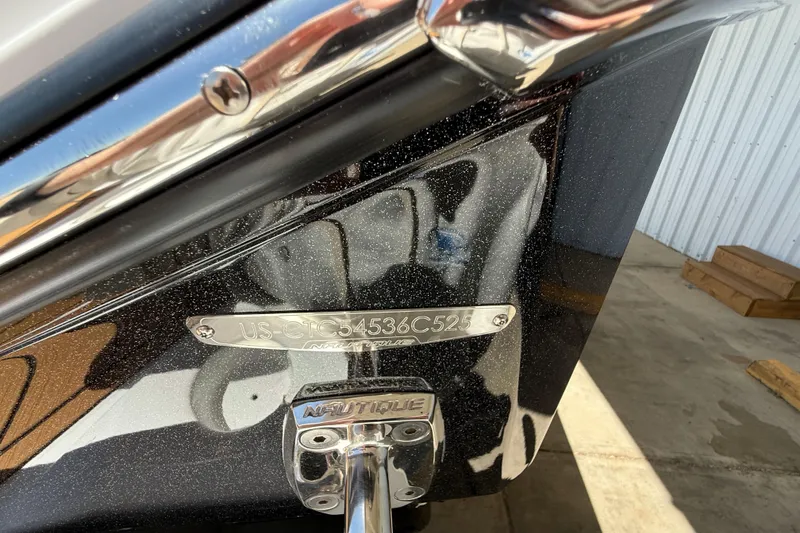 Slide: The Image of 2025 Nautique Super Air Nautique G23 boat hull identification number plate. - 18