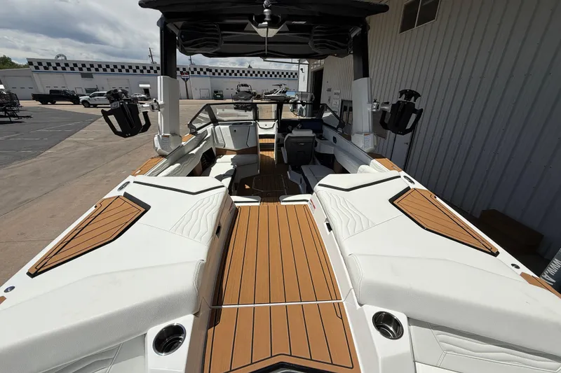 Slide: The Image of 2025 Nautique Super Air Nautique G23 boat interior with sleek design and spacious seating. - 7