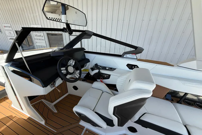 Slide: The Image of 2025 Nautique Super Air Nautique G23 boat interior with sleek design and modern controls. - 9