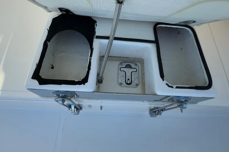 Slide: The Image of Open storage compartment on a 2005 Albemarle 280 Express Fisherman boat. - 11