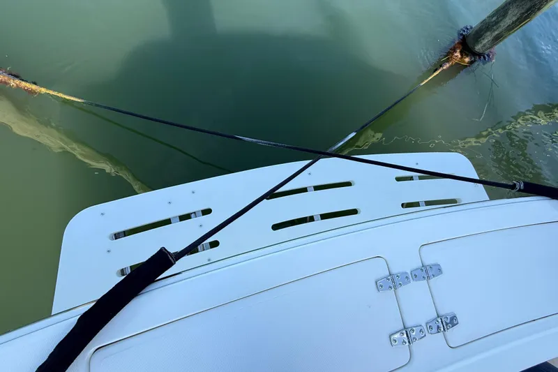 Slide: The Image of 2005 Albemarle 280 Express Fisherman boat stern with dock lines in water. - 16