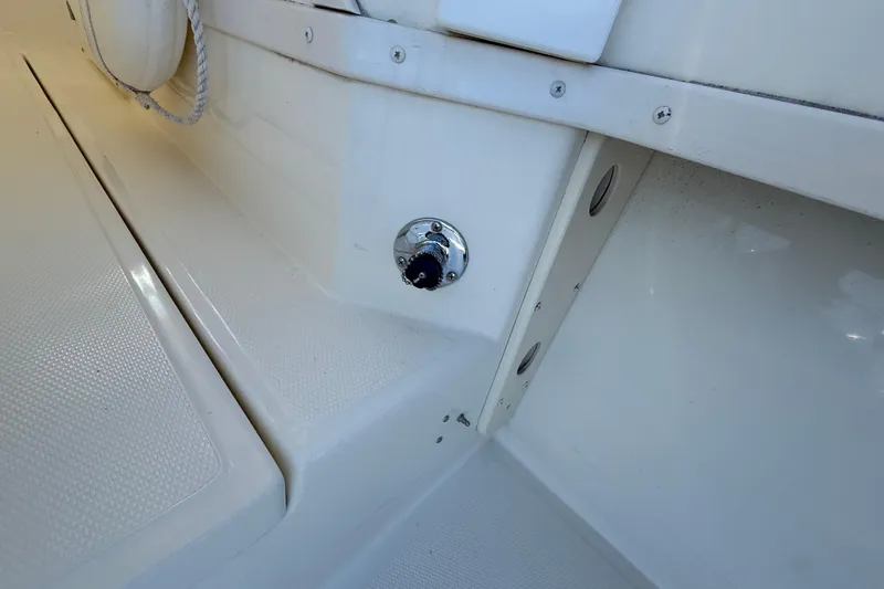 Slide: The Image of 2005 Albemarle 280 Express Fisherman boat interior detail, featuring a clean, white deck area. - 21