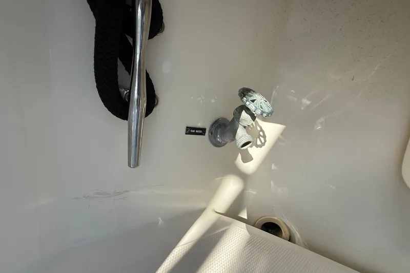 Slide: The Image of 2005 Albemarle 280 Express Fisherman boat interior with faucet and rope detail. - 22